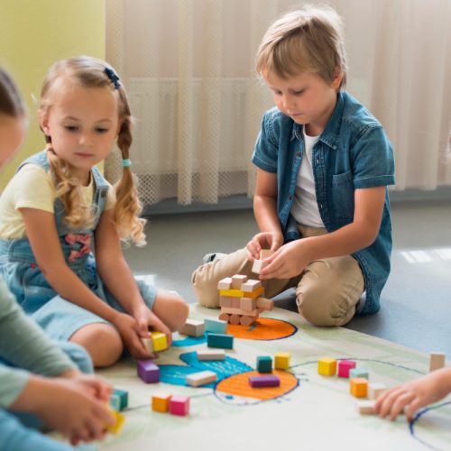 front-view-children-playing-together-kindergarten front-view-children-playing-together-kindergarten