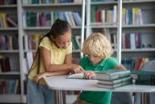 two-hard-working-classmates-doing-their-homework-library (1)